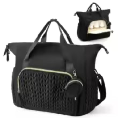 Sac à langer luxueux noir avec compartiment bouteille ouvert